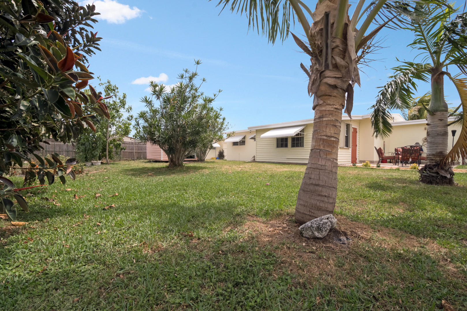 320 East Lake Road Palm Springs, FL 33461 - Photo 21 of 22 a view of a house with a yard