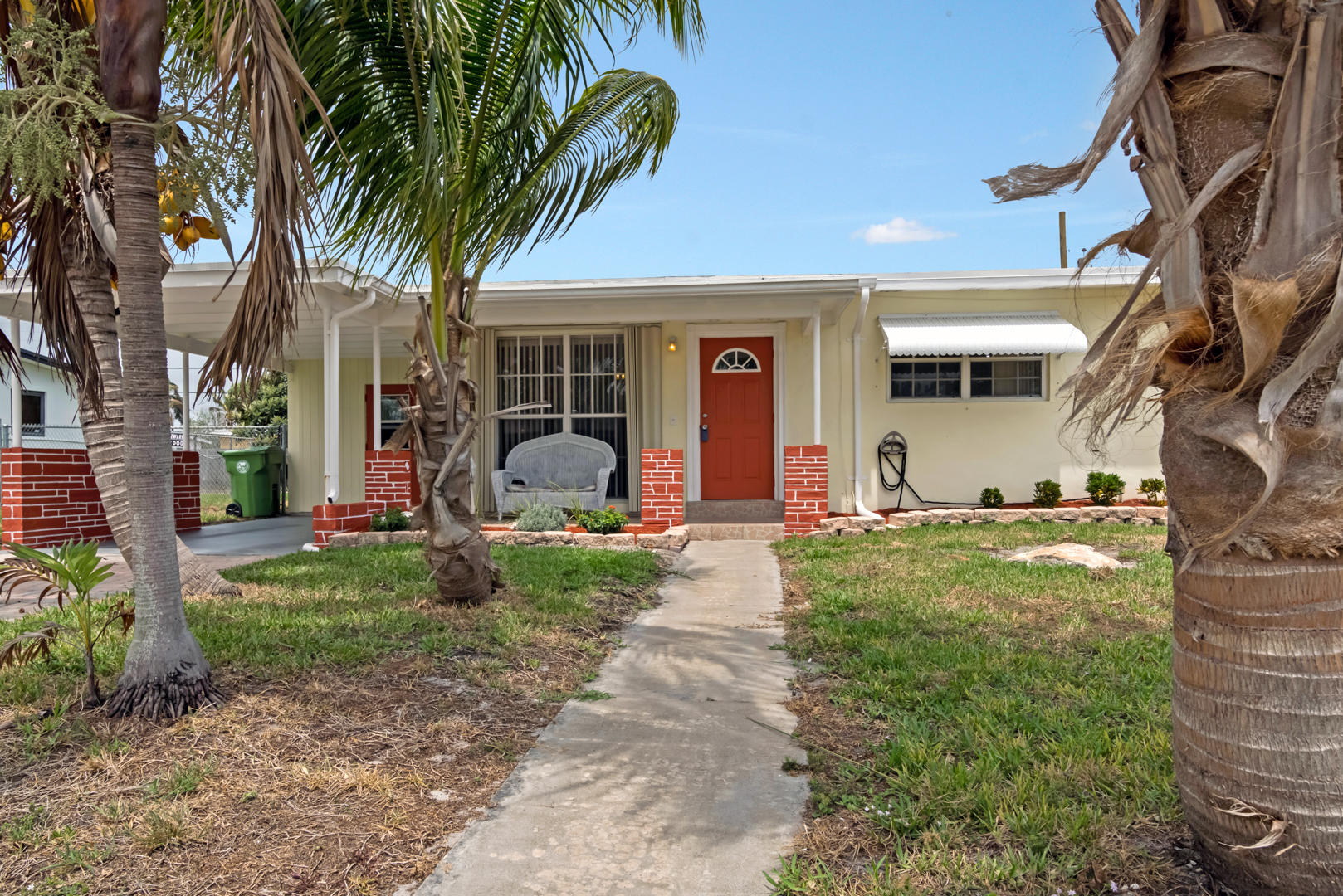 320 East Lake Road Palm Springs, FL 33461 - Photo 3 of 22 a view of a house with backyard and a tree