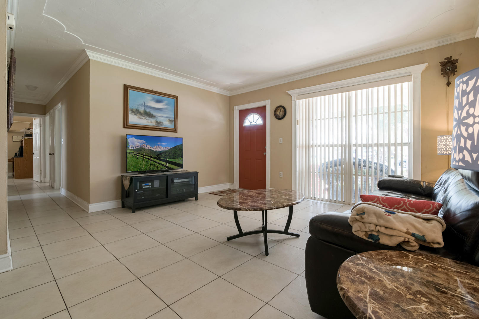 320 East Lake Road Palm Springs, FL 33461 - Photo 4 of 22 a living room with furniture and a flat screen tv