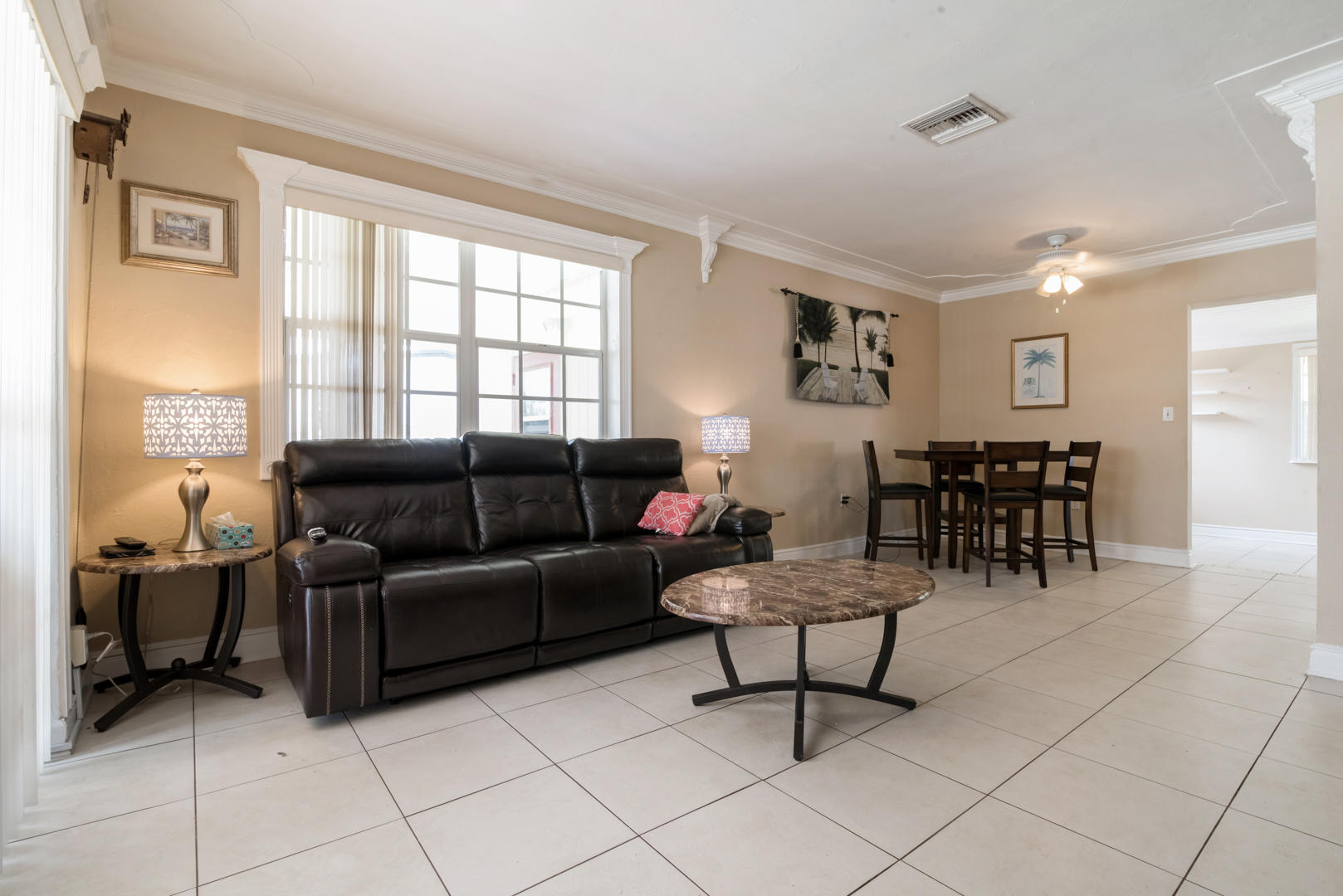 320 East Lake Road Palm Springs, FL 33461 - Photo 6 of 22 a living room with furniture and a large window