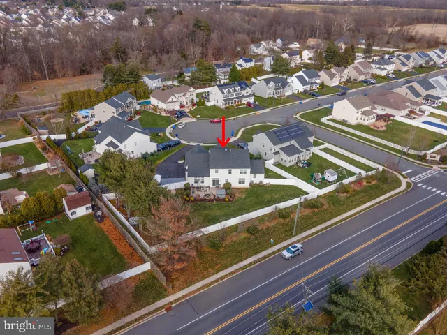 an aerial view of a house with table and chairs