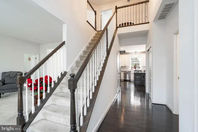 a kitchen with lots of counter space a sink dining table and chairs