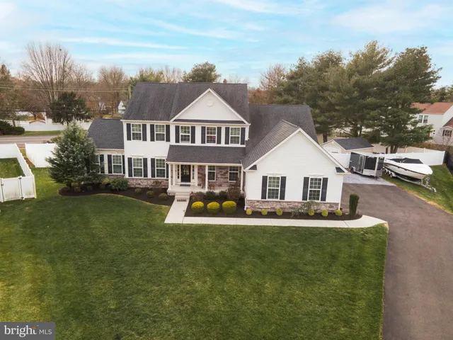 a front view of a house with a yard table and chairs