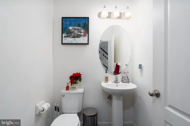 a bedroom with furniture and a potted plant