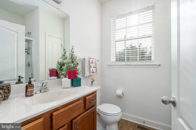 a view of a hallway with a livingroom and stairs