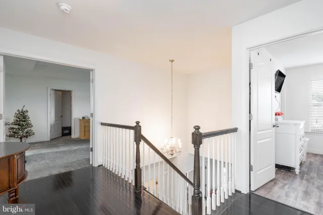 a view of walk in closet with clothes