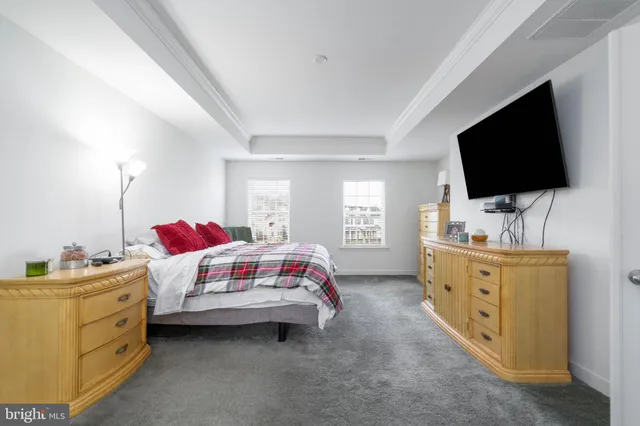 a view of a kitchen area with furniture and windows