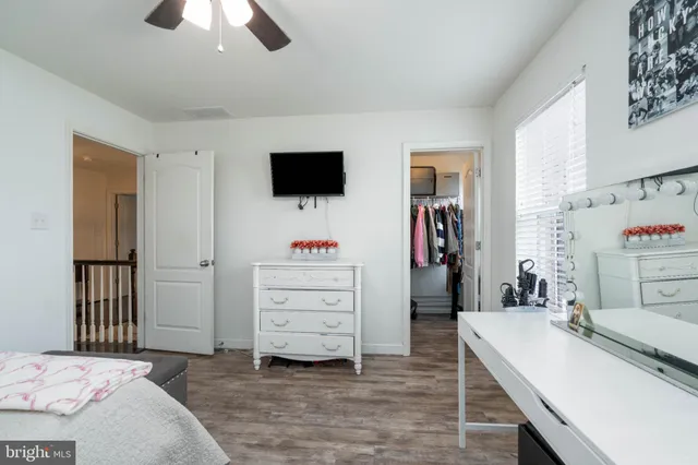 a bed room with a bed and a night stand