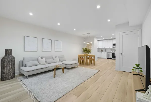 a living room with furniture and a table