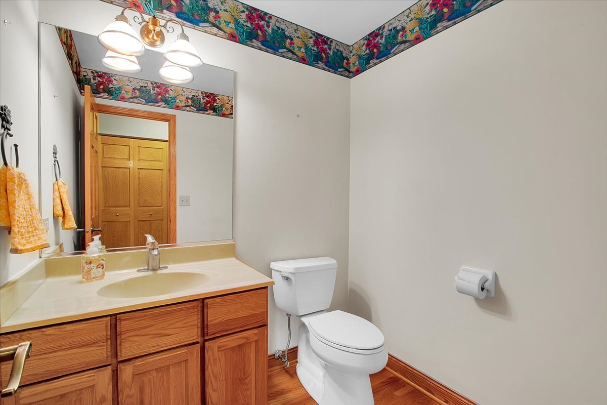 90 Briargate Road Cary, IL 60013 - Photo 11 of 42 a bathroom with a sink mirror vanity and toilet