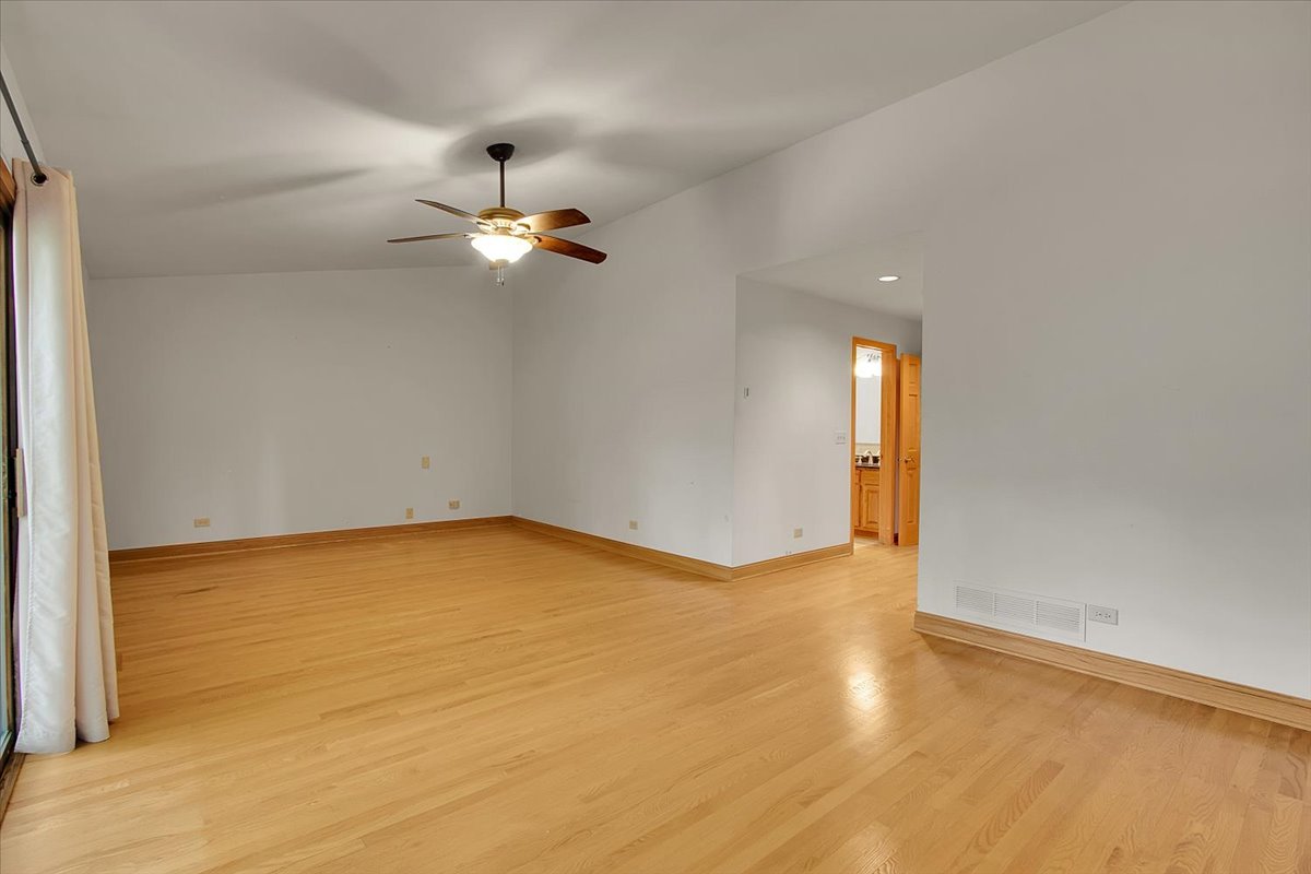 90 Briargate Road Cary, IL 60013 - Photo 14 of 42 wooden floor in an empty room with a window