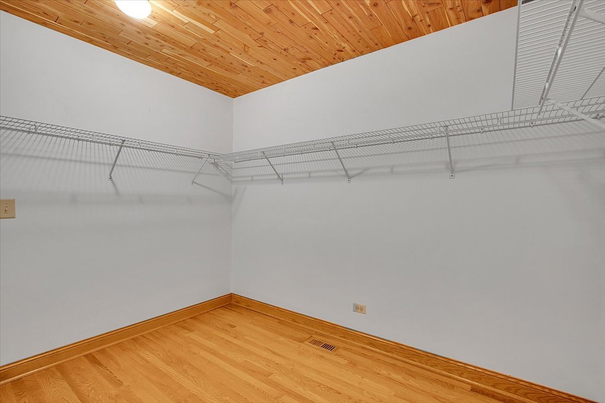 90 Briargate Road Cary, IL 60013 - Photo 15 of 42 a view of a room with racks on the wall
