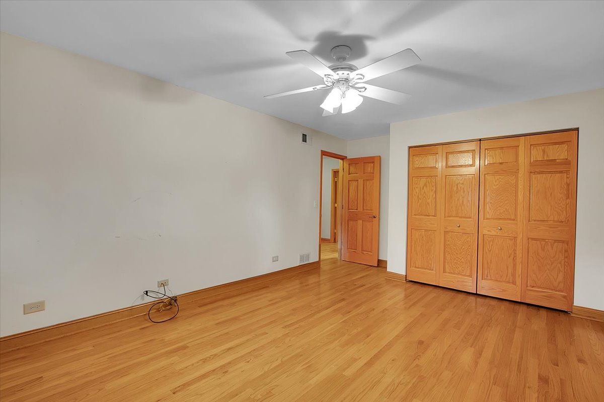 90 Briargate Road Cary, IL 60013 - Photo 19 of 42 a view of an empty room with wooden floor