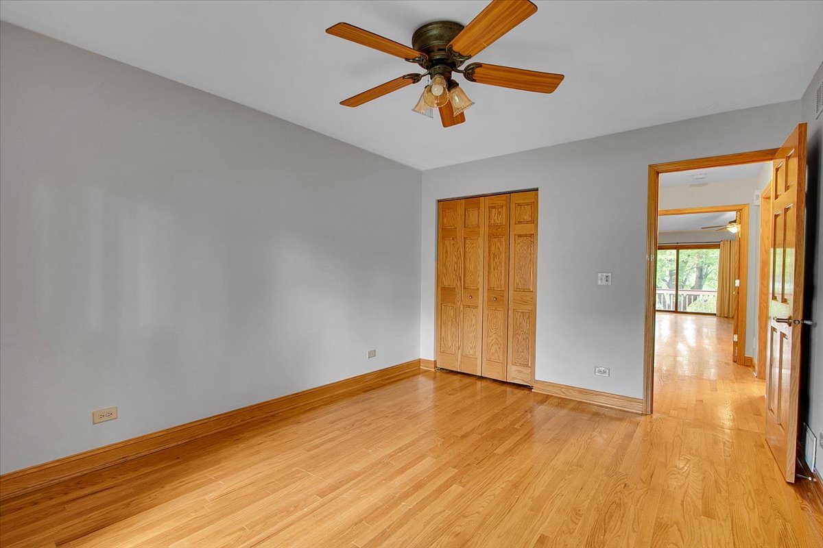 90 Briargate Road Cary, IL 60013 - Photo 21 of 42 wooden floor in an empty room with a window