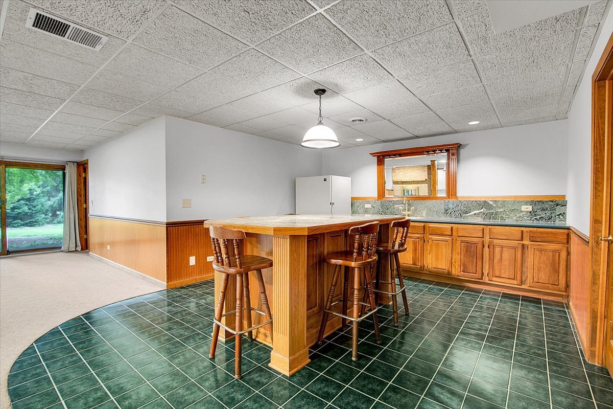 90 Briargate Road Cary, IL 60013 - Photo 27 of 42 a view of kitchen with granite countertop window and a sink