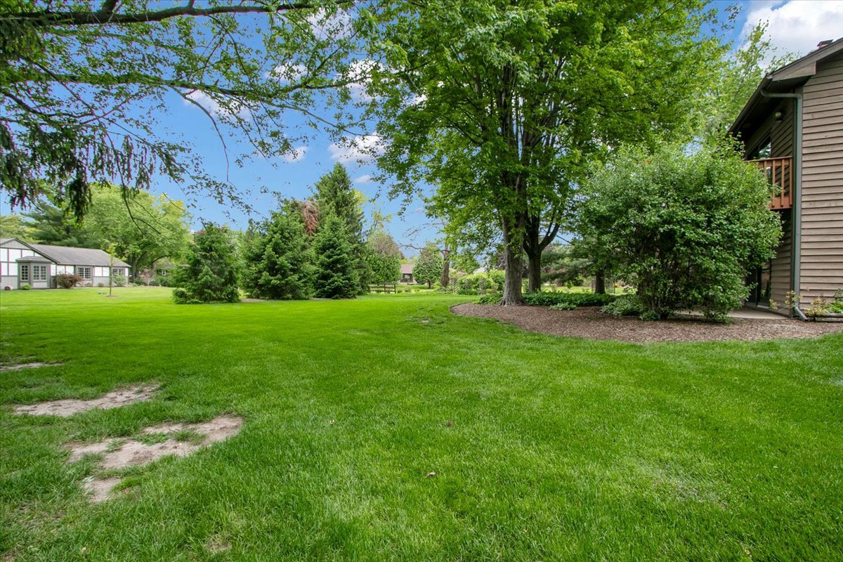 90 Briargate Road Cary, IL 60013 - Photo 37 of 42 a view of green field with trees in the background
