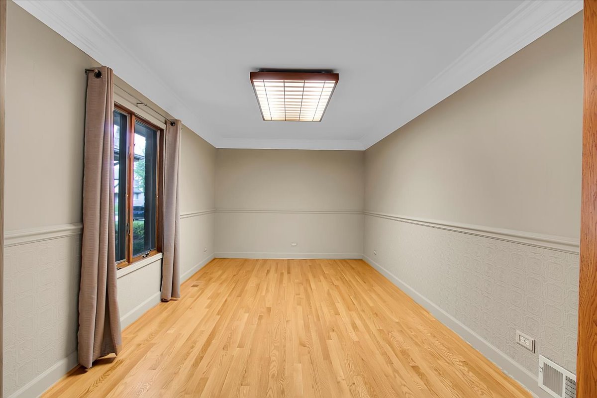 90 Briargate Road Cary, IL 60013 - Photo 9 of 42 a view of empty room with wooden floor