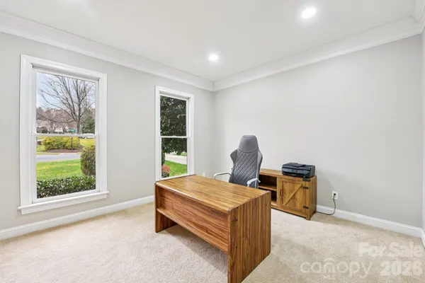 a bedroom with bed and a window