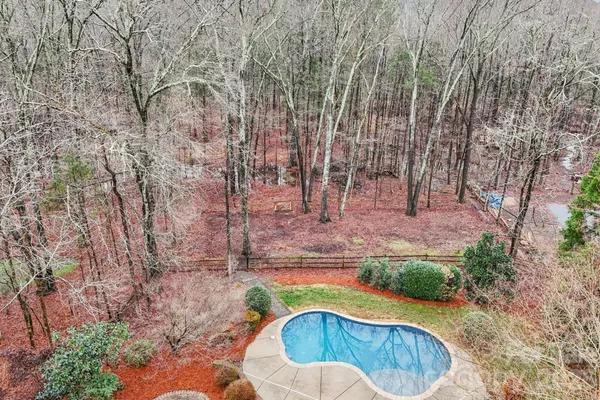 an aerial view of a house with outdoor space