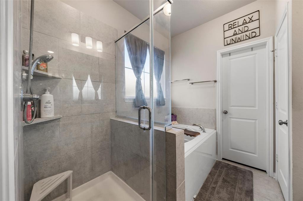 3525 Beutel Road Lorena, TX 76655 - Photo 13 of 34 a bathroom with a granite countertop sink a toilet and shower
