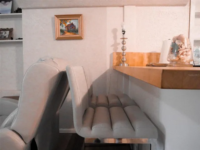 a bedroom with a bed and a mirror