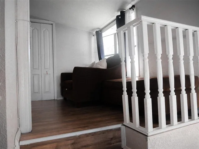 a bathroom with a toilet and a shower curtain