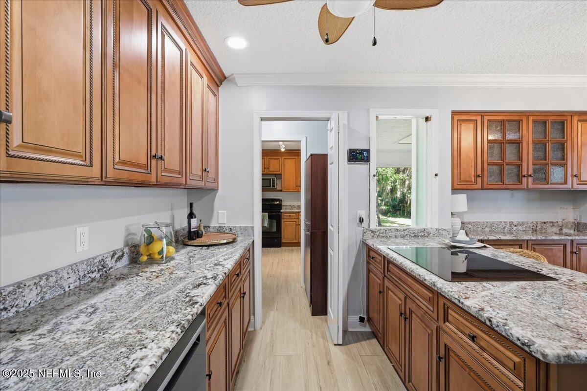4447 Cedar Road Orange Park, FL 32065 - Photo 17 of 100 a kitchen with granite countertop stainless steel appliances window a sink and cabinets