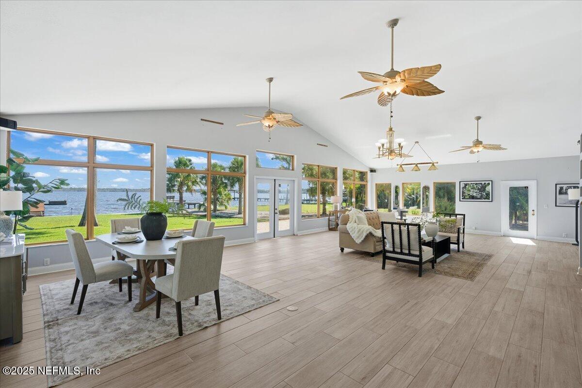 4447 Cedar Road Orange Park, FL 32065 - Photo 26 of 100 a dining room with furniture a chandelier and wooden floor