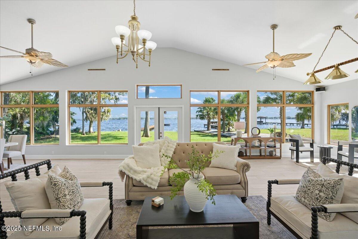 4447 Cedar Road Orange Park, FL 32065 - Photo 29 of 100 a living room with furniture chandelier and a window