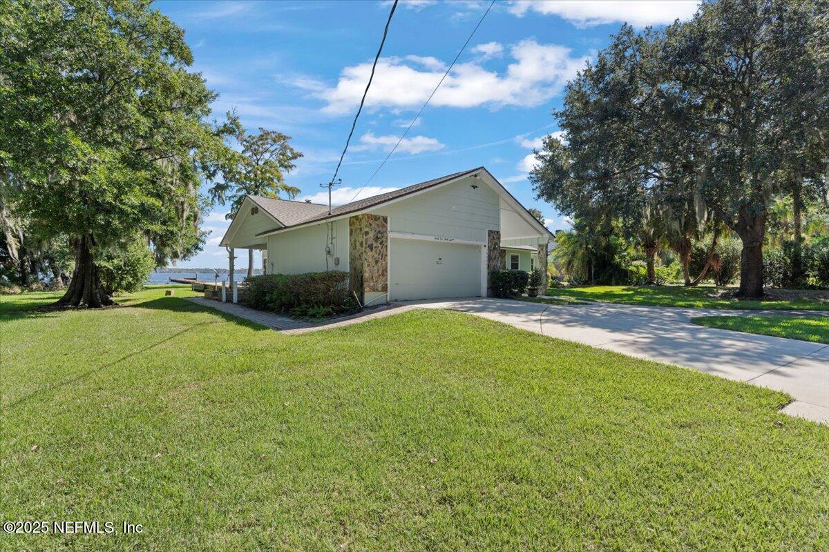 4447 Cedar Road Orange Park, FL 32065 - Photo 58 of 100 a house view with a garden space