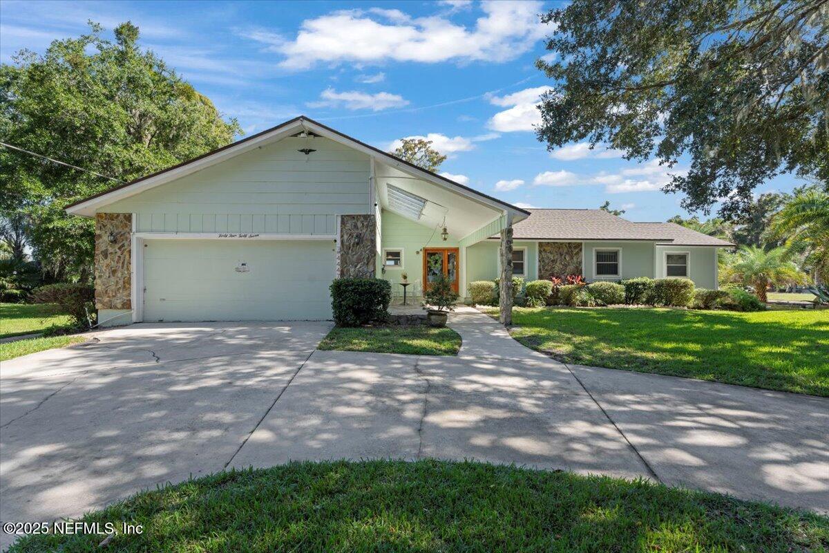 4447 Cedar Road Orange Park, FL 32065 - Photo 59 of 100 a view of a house with a yard