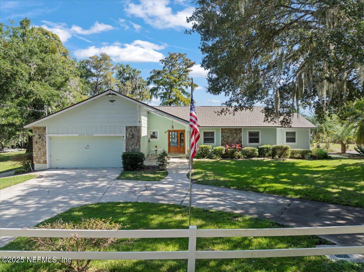4447 Cedar Road Orange Park, FL 32065 - Photo 60 of 100 a view of a house with a yard