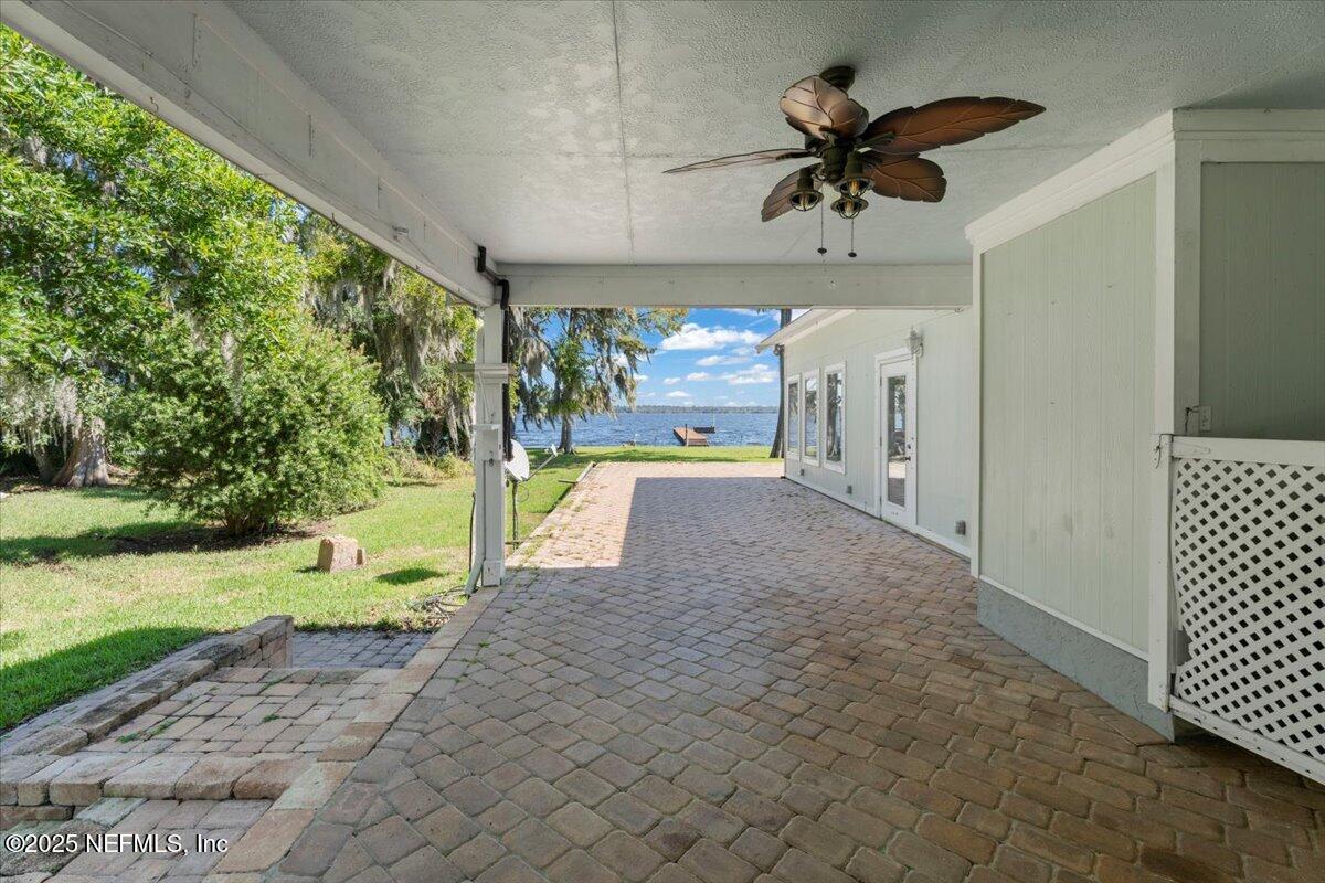 4447 Cedar Road Orange Park, FL 32065 - Photo 63 of 100 a view of a porch with a table and chairs