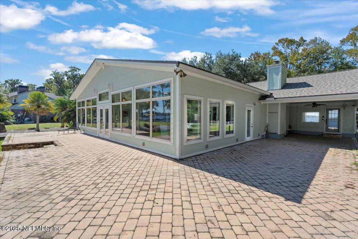 4447 Cedar Road Orange Park, FL 32065 - Photo 64 of 100 a view of house with backyard and glass windows