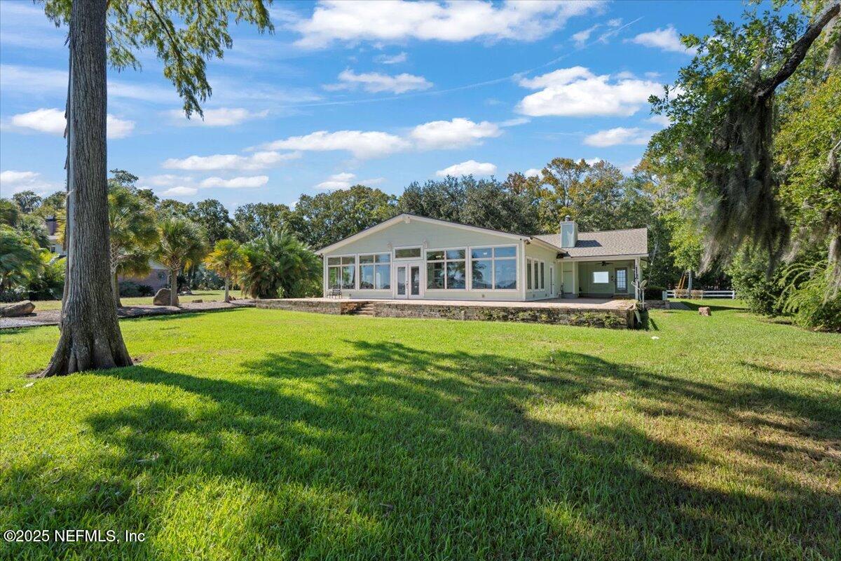 4447 Cedar Road Orange Park, FL 32065 - Photo 66 of 100 a front view of house with yard and green space
