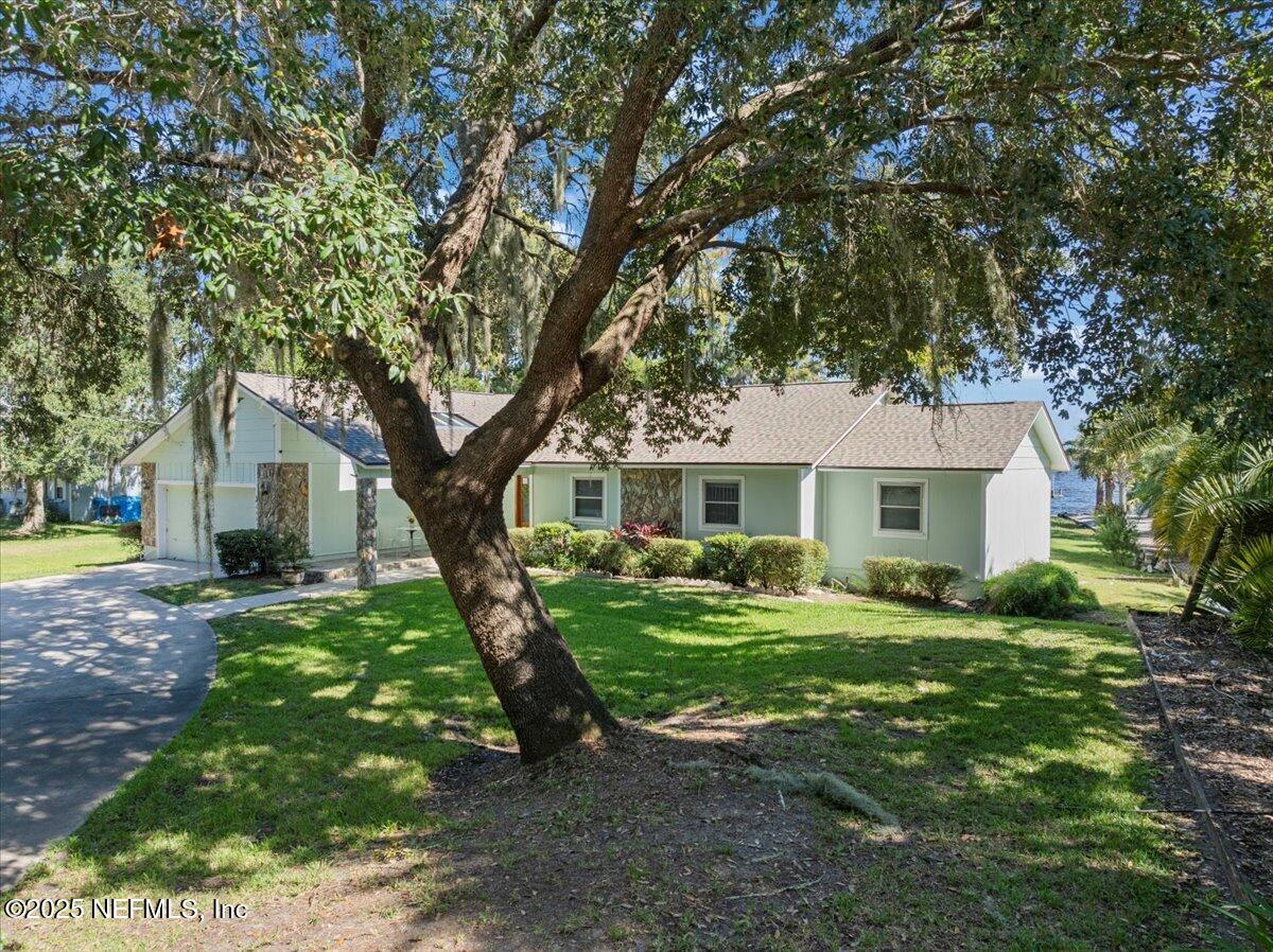 4447 Cedar Road Orange Park, FL 32065 - Photo 77 of 100 a front view of a house with a yard