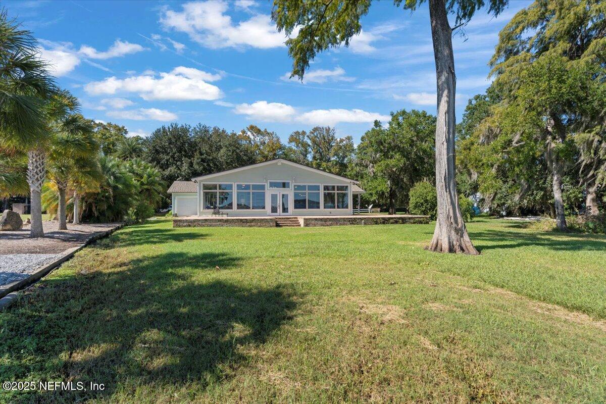 4447 Cedar Road Orange Park, FL 32065 - Photo 78 of 100 a front view of house with yard and green space