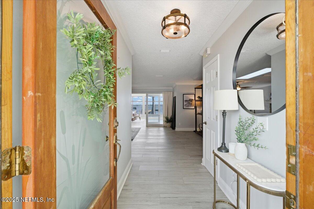 4447 Cedar Road Orange Park, FL 32065 - Photo 8 of 100 a view of a hallway to a livingroom with furniture