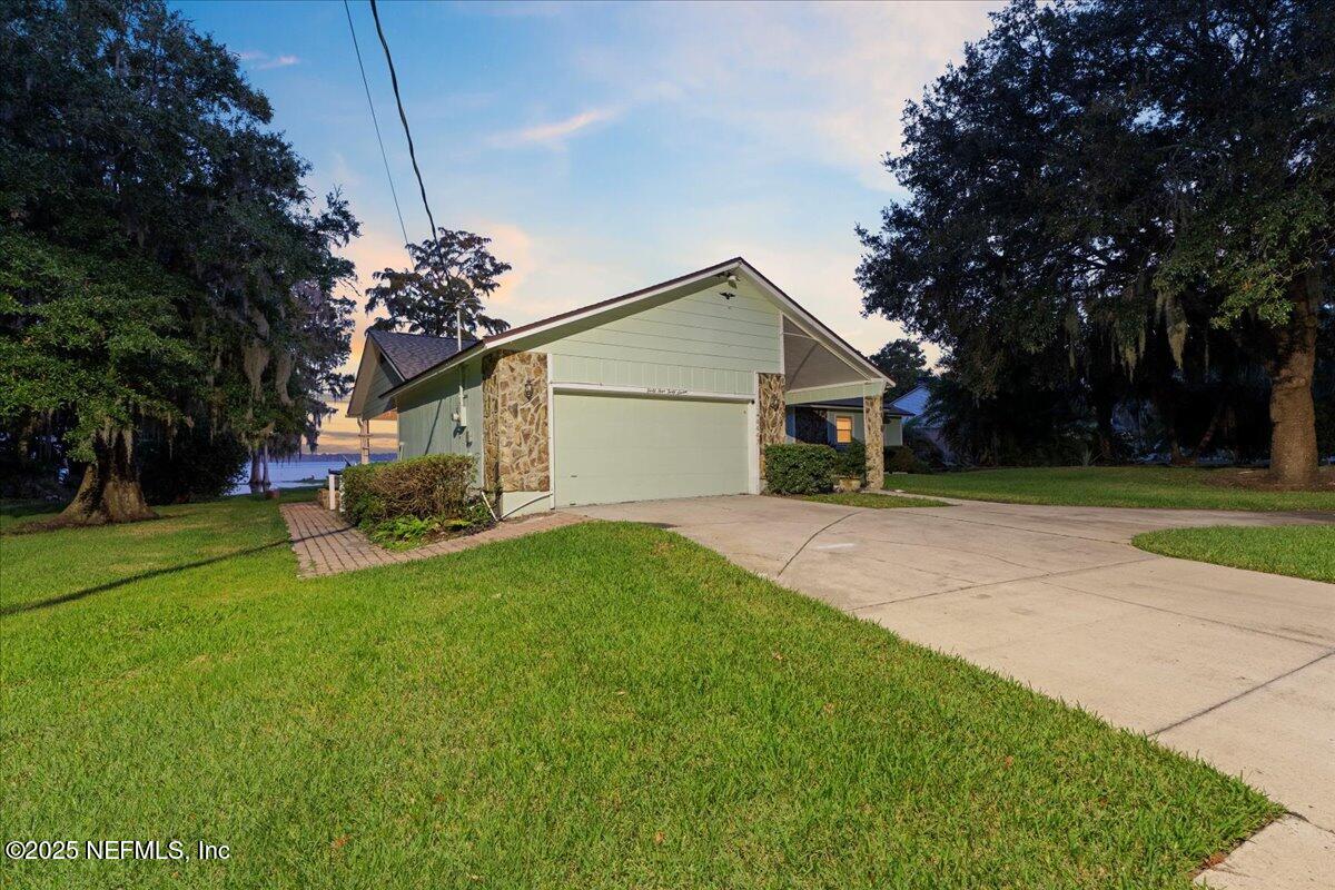 4447 Cedar Road Orange Park, FL 32065 - Photo 92 of 100 a view of a house with a yard