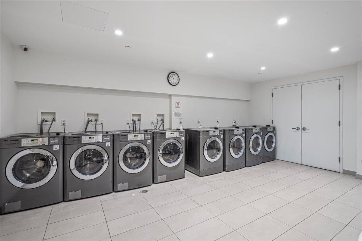 87-22 51st Avenue, Unit 4H Queens, NY 11373 - Photo 13 of 17 Common laundry area featuring recessed lighting, light tile patterned floors, and washing machine and clothes dryer