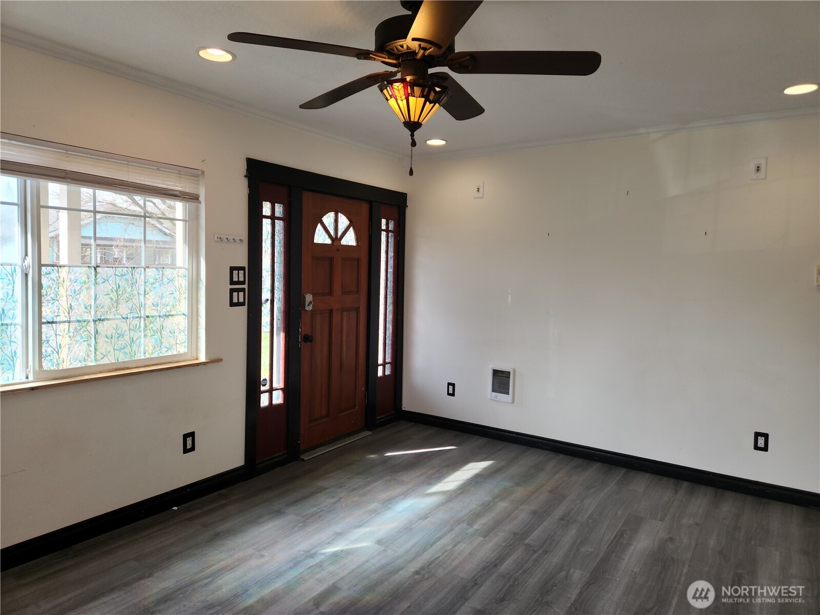 2902 Dover Street Longview, WA 98632 - Photo 10 of 23 a view of an empty room with window and wooden floor