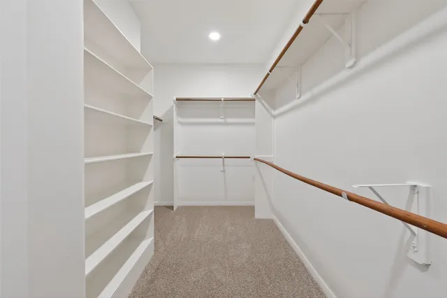 a view of an empty walk in closet