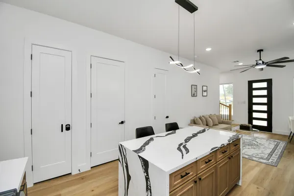 a spacious bathroom with a sink vanity and a mirror