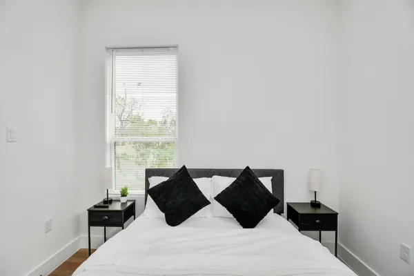 a bedroom with a bed and a dresser