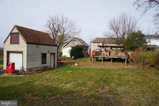 a view of a house with backyard porch and sitting area