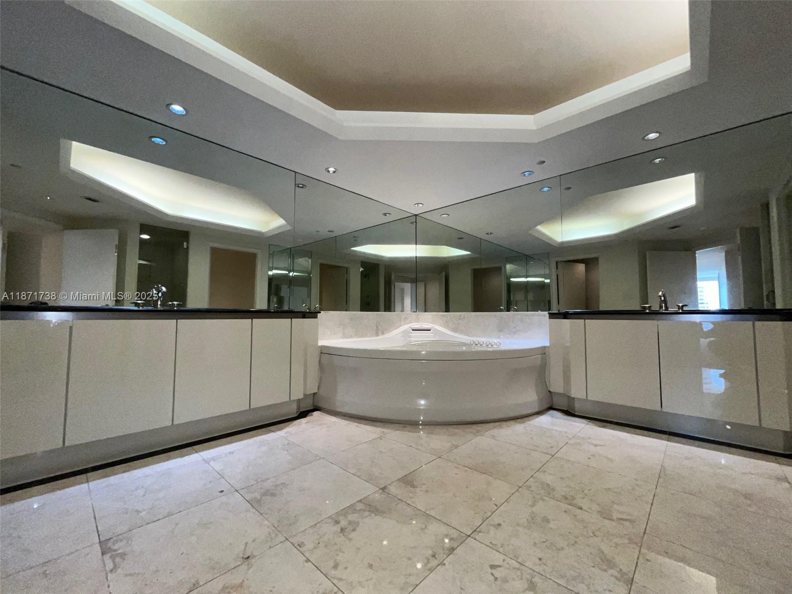 2600 East Island Boulevard, Unit 1503 Aventura, FL 33160 - Photo 12 of 36 a large room with a large window