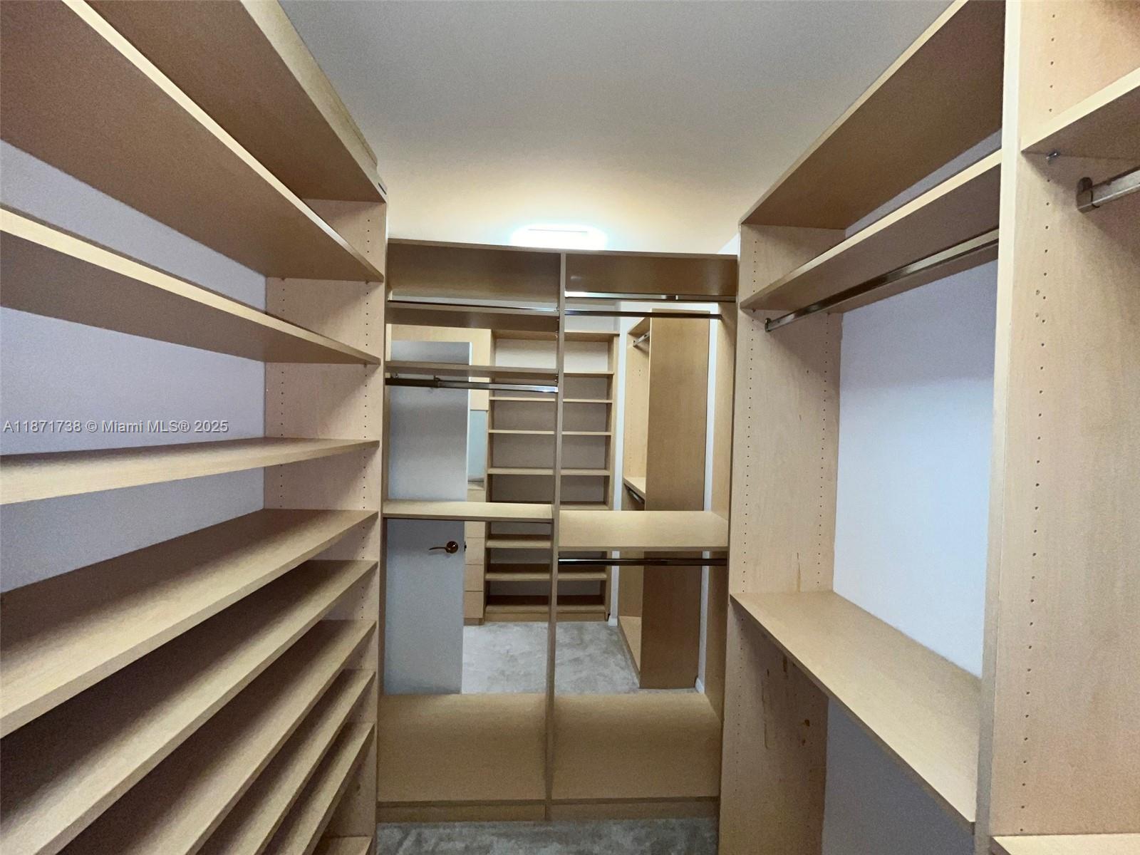 2600 East Island Boulevard, Unit 1503 Aventura, FL 33160 - Photo 15 of 36 a view of a room with racks on the wall