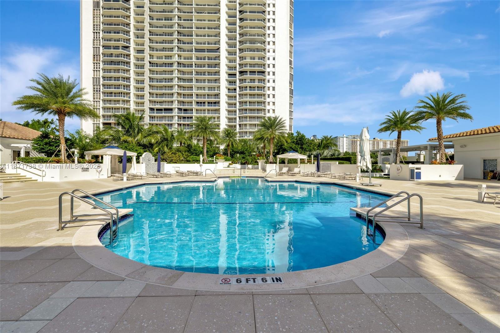 2600 East Island Boulevard, Unit 1503 Aventura, FL 33160 - Photo 28 of 36 a view of a swimming pool with a lounge chair