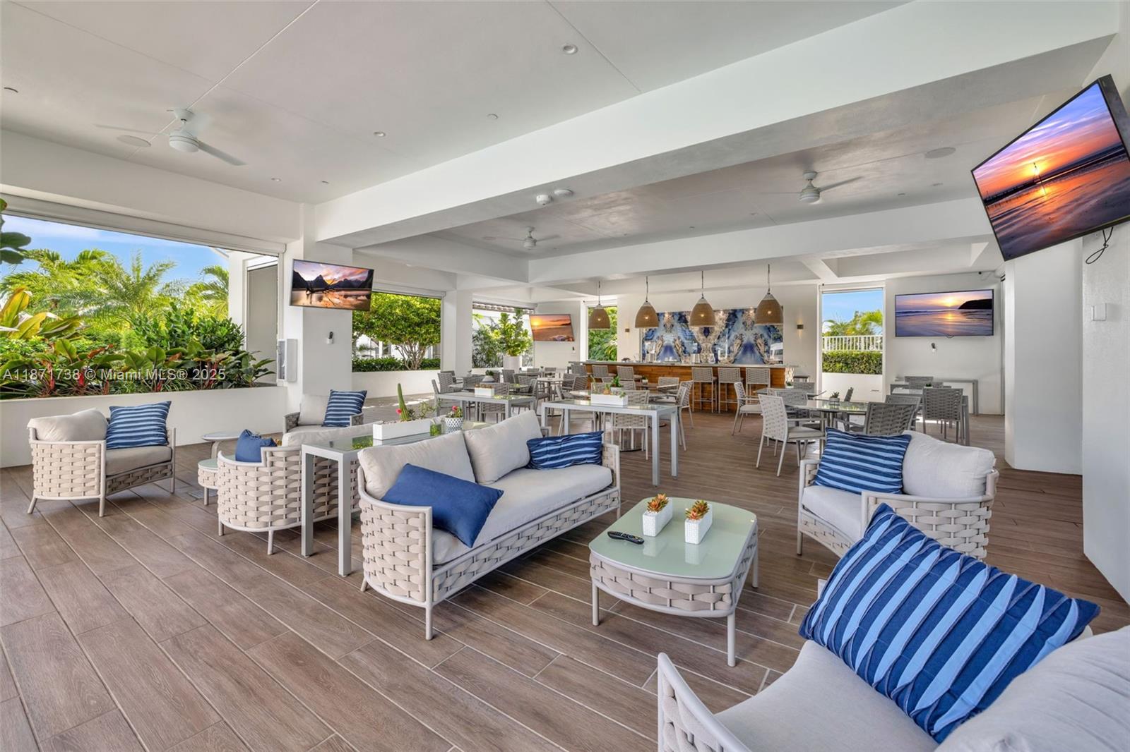 2600 East Island Boulevard, Unit 1503 Aventura, FL 33160 - Photo 29 of 36 a living room with furniture and a flat screen tv