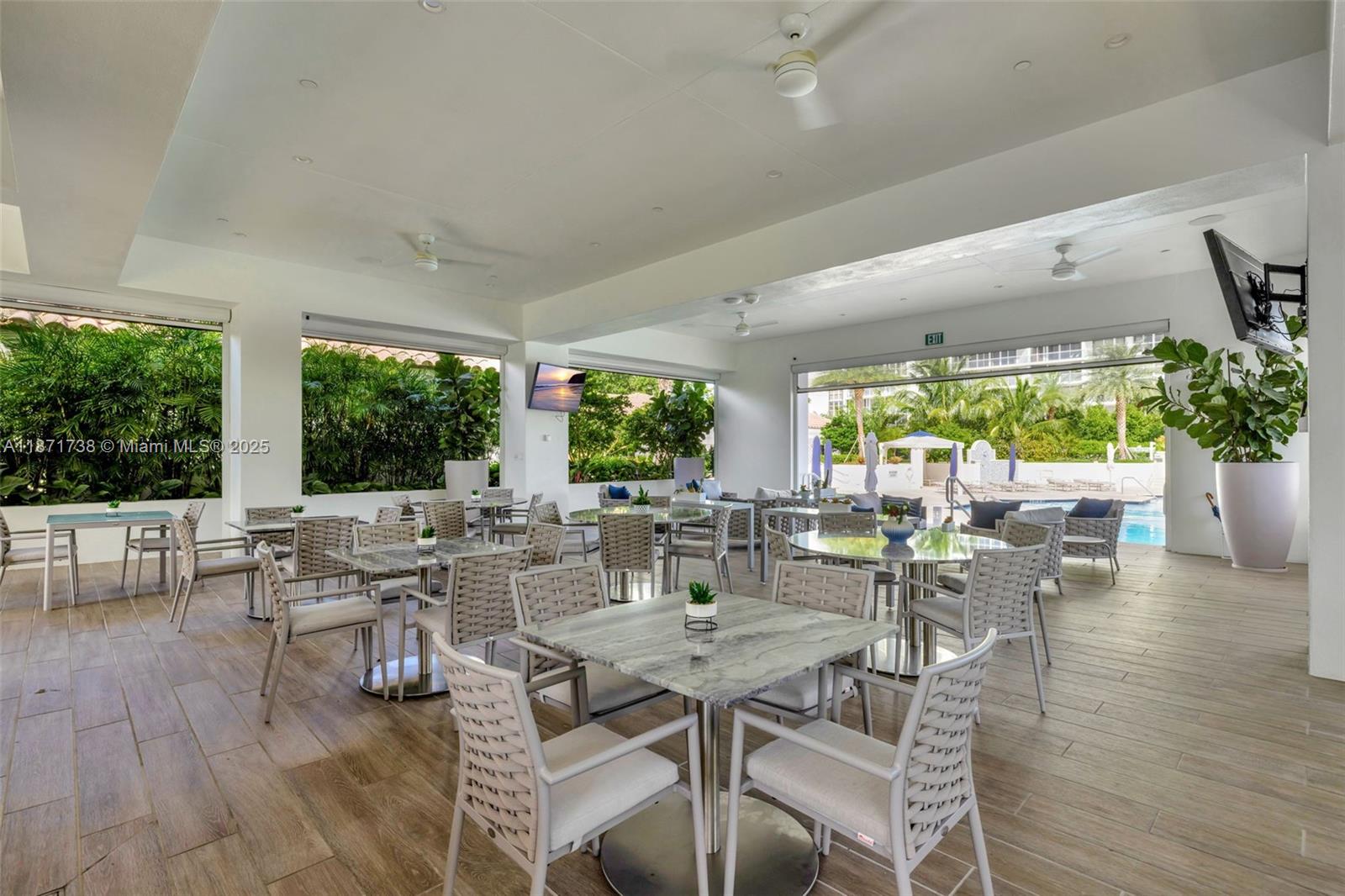2600 East Island Boulevard, Unit 1503 Aventura, FL 33160 - Photo 31 of 36 a view of a dining room with furniture window and outside view